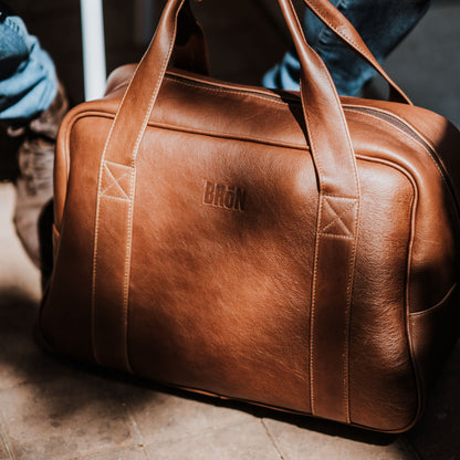 Front view of premium leather travel bag, made from the finest quality leather with added padding. It has an exclusive look and luxurious feel.