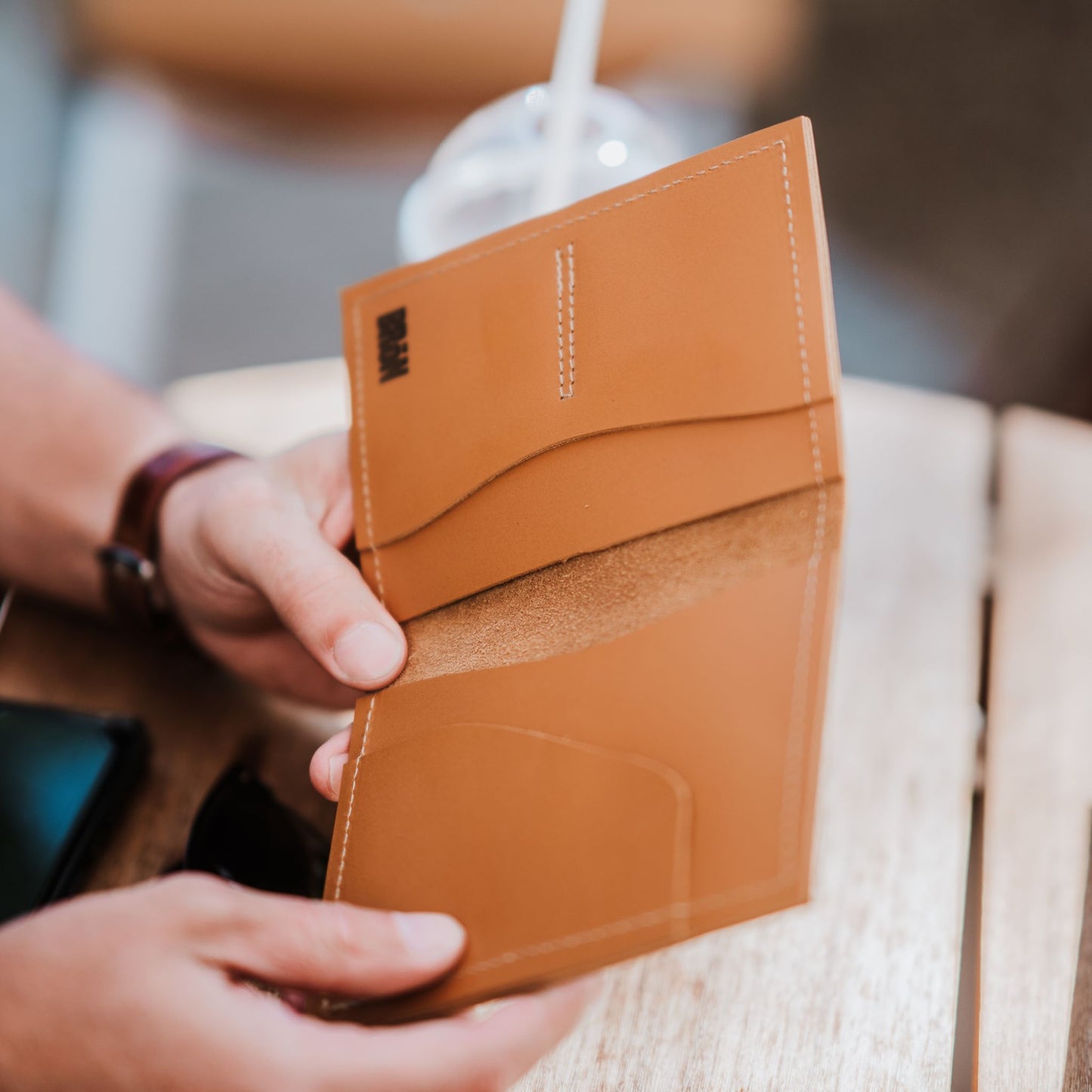 Inside view of leather passport holder and travel wallet.