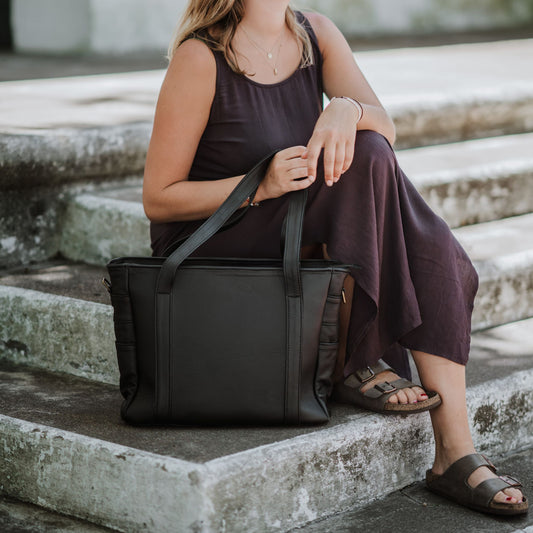 Front view of the leather laptop tote, showcasing the handles.